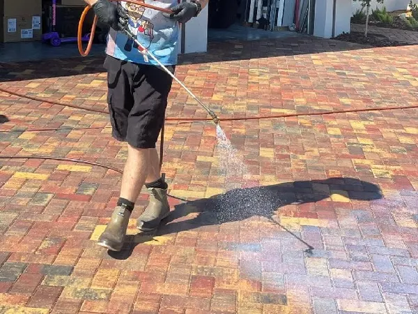 Our technician applying paver sealer