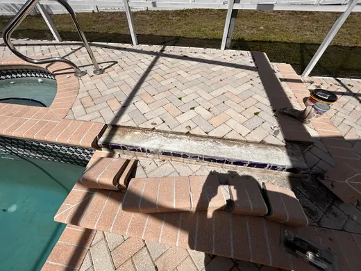 New Port Richey pool-deck pavers during sealing prep