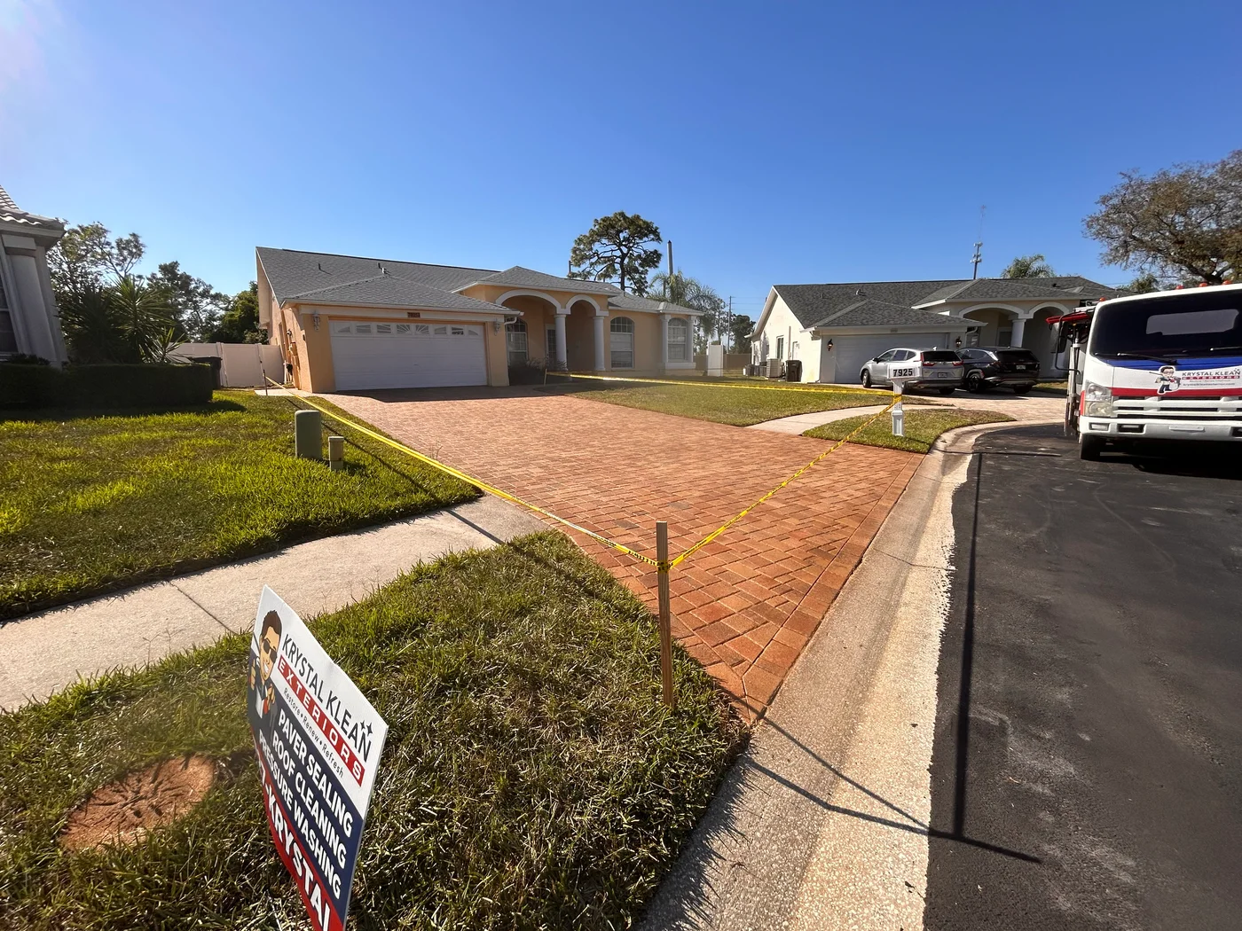 Three-coat sealed paver driveway completed by Krystal Klean Exterior in New Port Richey, Florida