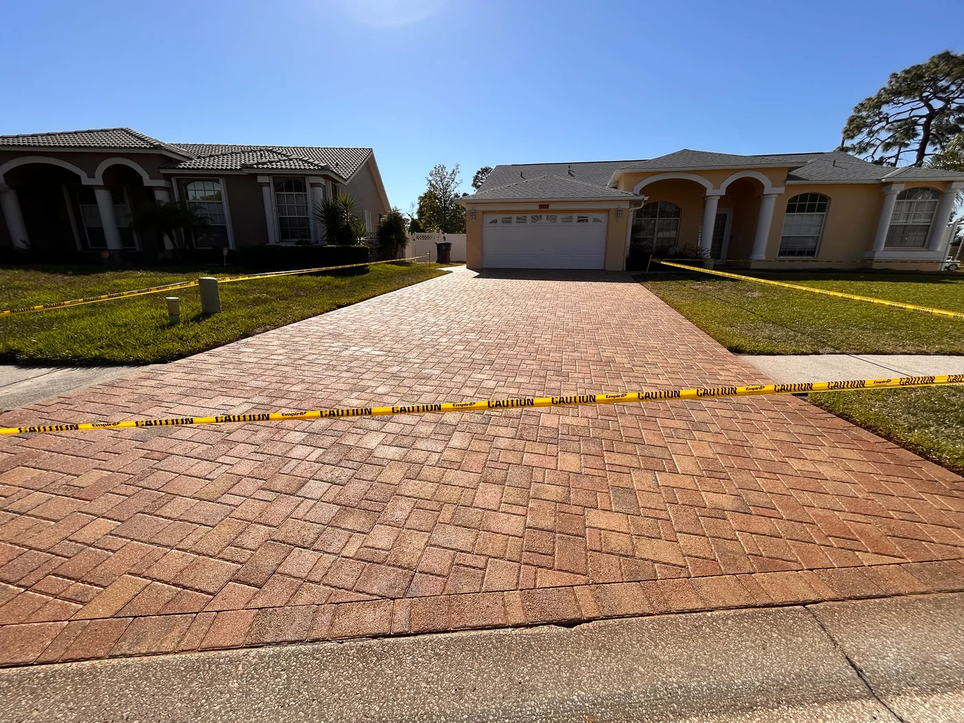 Front view of a sealed paver driveway completed by Krystal Klean Exterior in New Port Richey