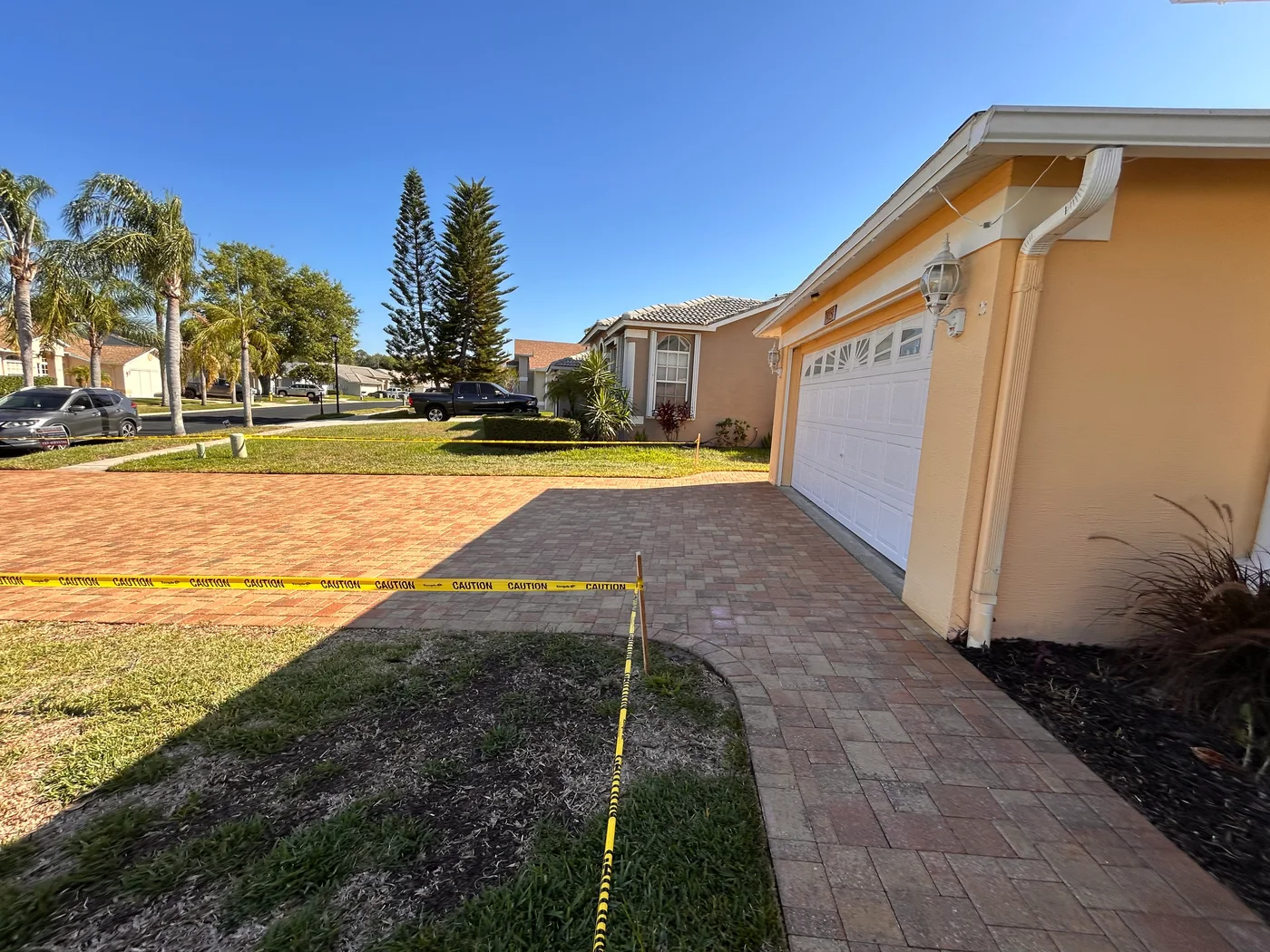Sealed paver driveway and garage-side walkway completed by Krystal Klean Exterior