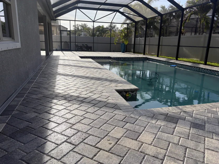 Palm Harbor screened paver pool deck after two coats of sealer