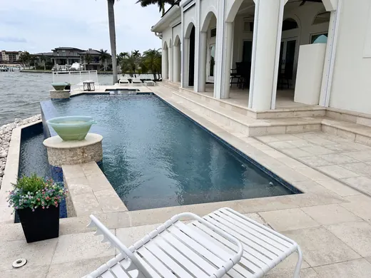 St. Pete Beach coastal pool-deck pavers before restoration prep
