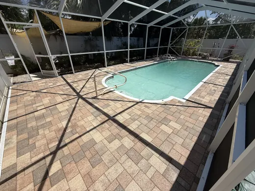 Tarpon Springs pool-deck pavers after cleaning and sealing