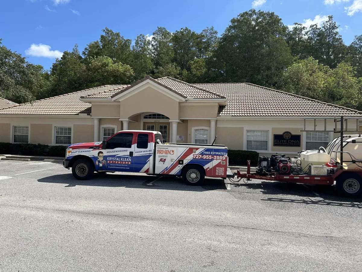 Krystal Klean truck and water trailer on site at a commercial building