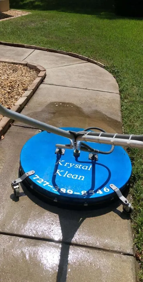 Krystal Klean surface cleaner working a community sidewalk